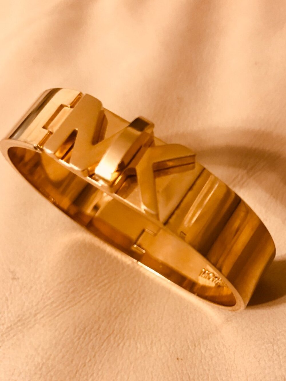 Michael Kors Gold Tone Hinged Bracelet With Gold Tone MK Logo